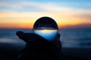 hand holding a glass sphere